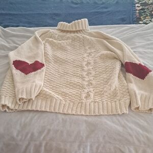 Cozy Cream Sweater with Red Heart Elbows